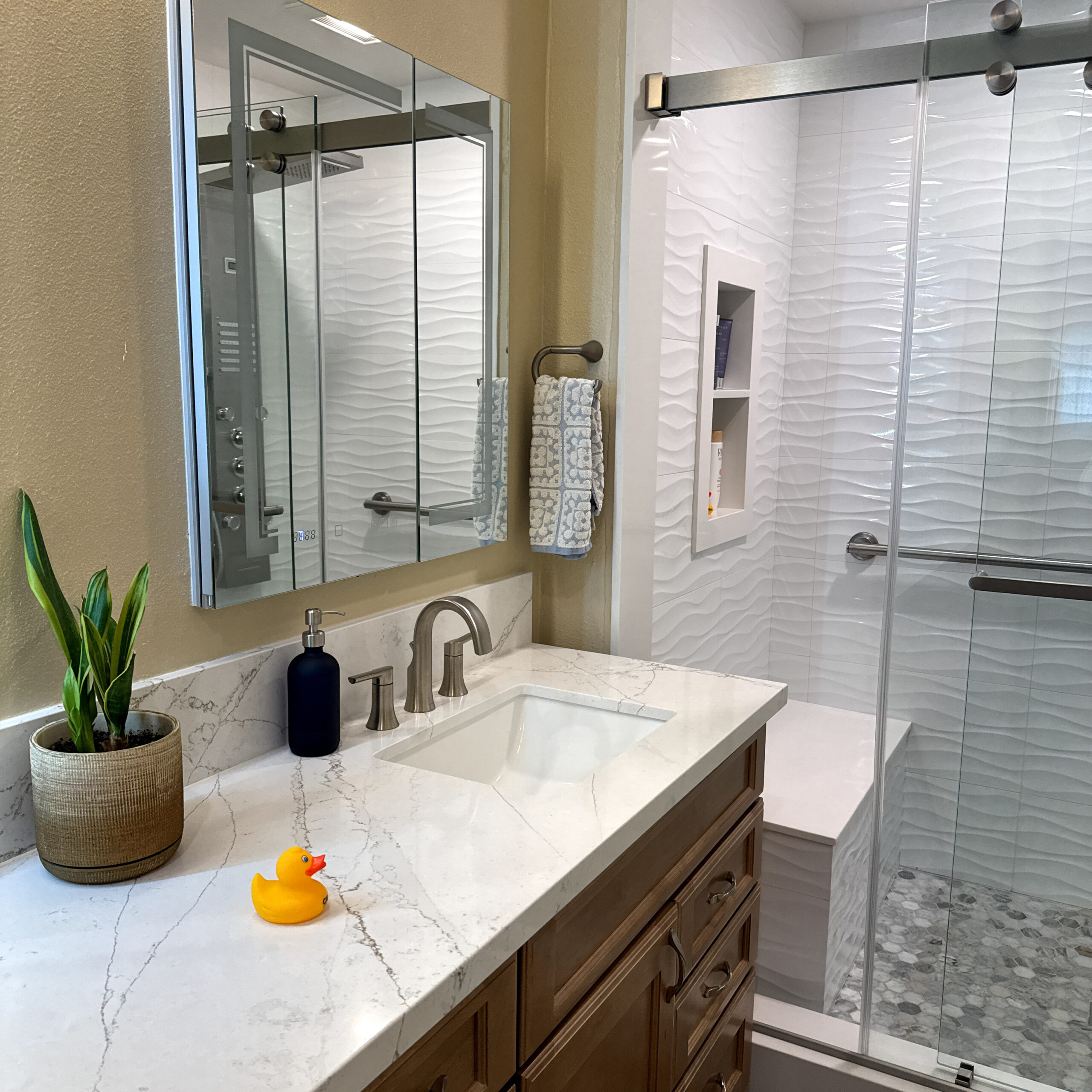 Updated Escondido bathroom with new vanity, improved storage, and modern tile replacing a dated 1970s layout