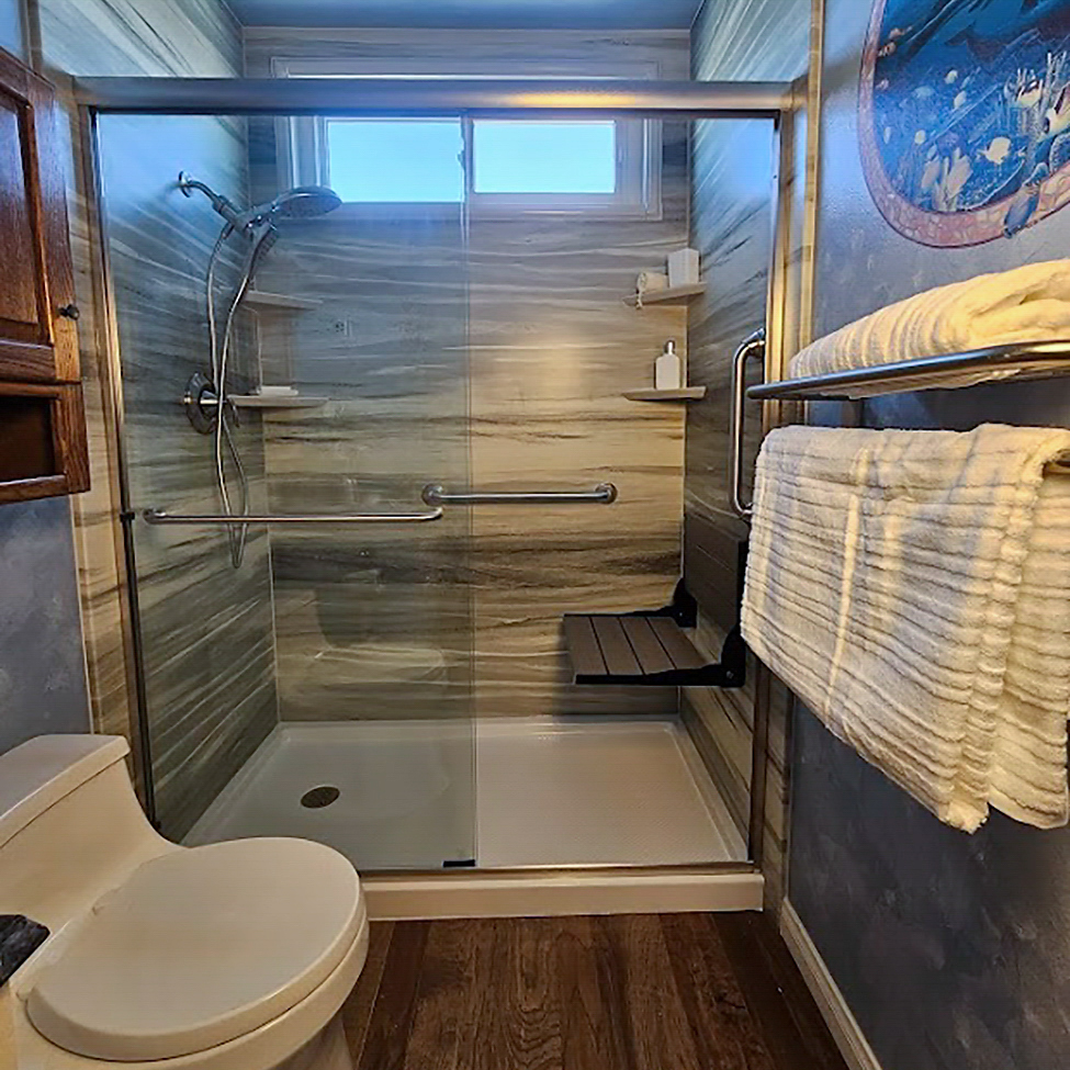 Tub-to-shower conversion in Garden Grove featuring low-threshold entry and easy-clean surround