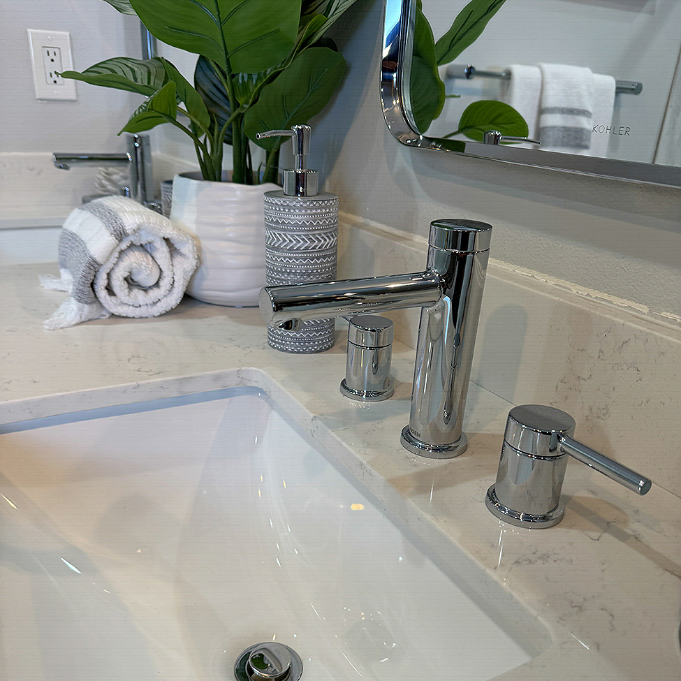 Close-up of upgraded sink fixtures in a Poway bathroom remodel