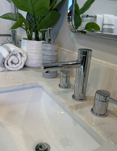 Close-up of new sink fixtures installed in a Torrance mid-century home