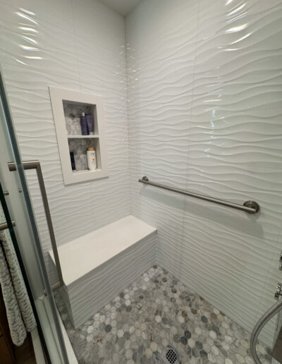 Handheld showerhead and modern fixtures installed during a Bellflower bathroom renovation by CALbath