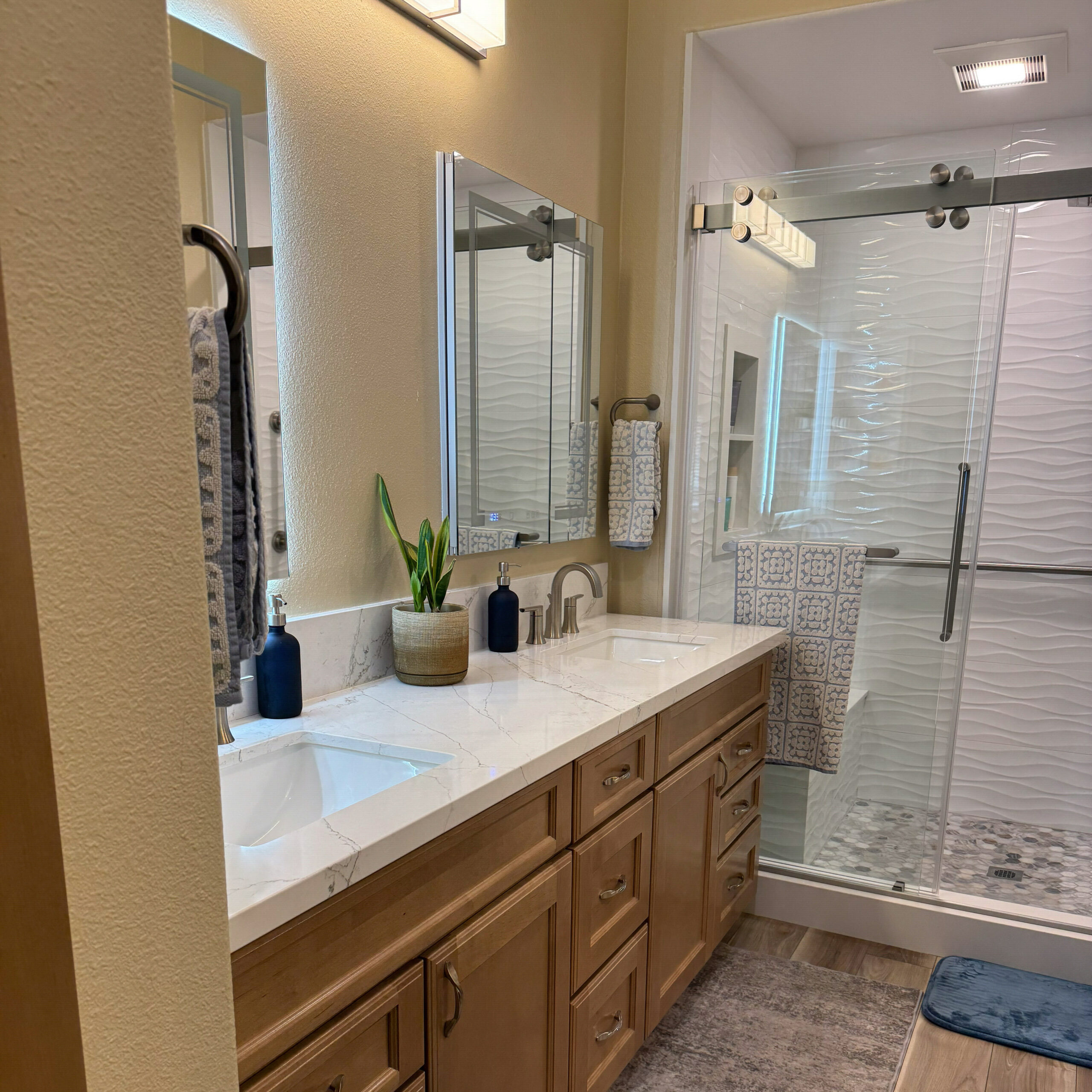 Updated Carson, CA bathroom with walk-in shower by CALbath Renovations