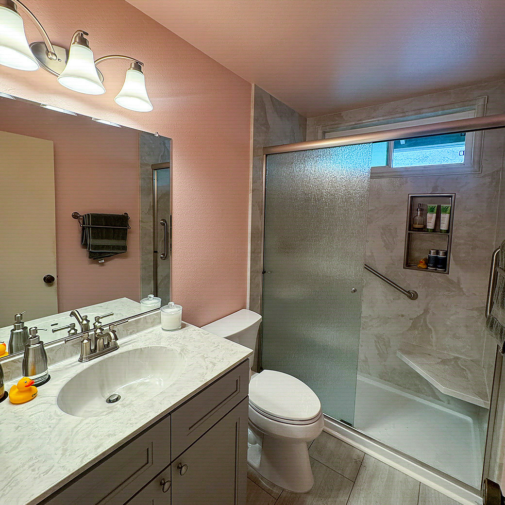 Modern Compton, CA bathroom with brushed nickel hardware and a glass shower door by CALbath Renovations