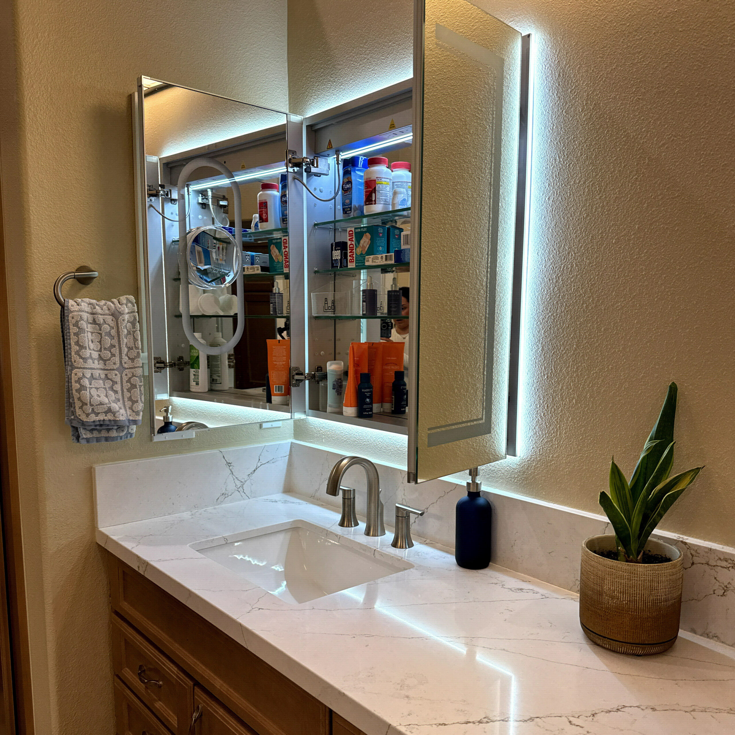 Compact Compton, CA bathroom remodel with a space-saving corner by CALbath Renovations
