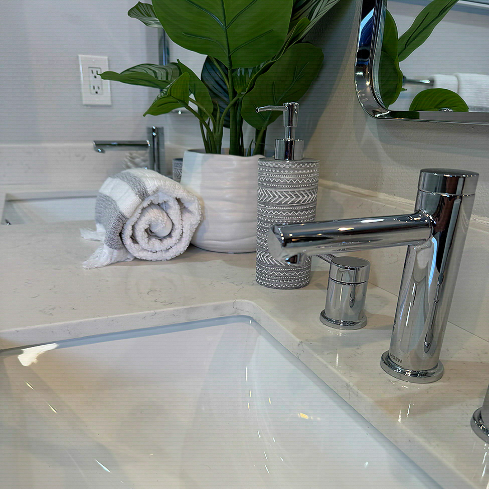 Bright bathroom remodel with white acrylic walls and brushed nickel fixtures by CALbath Renovations