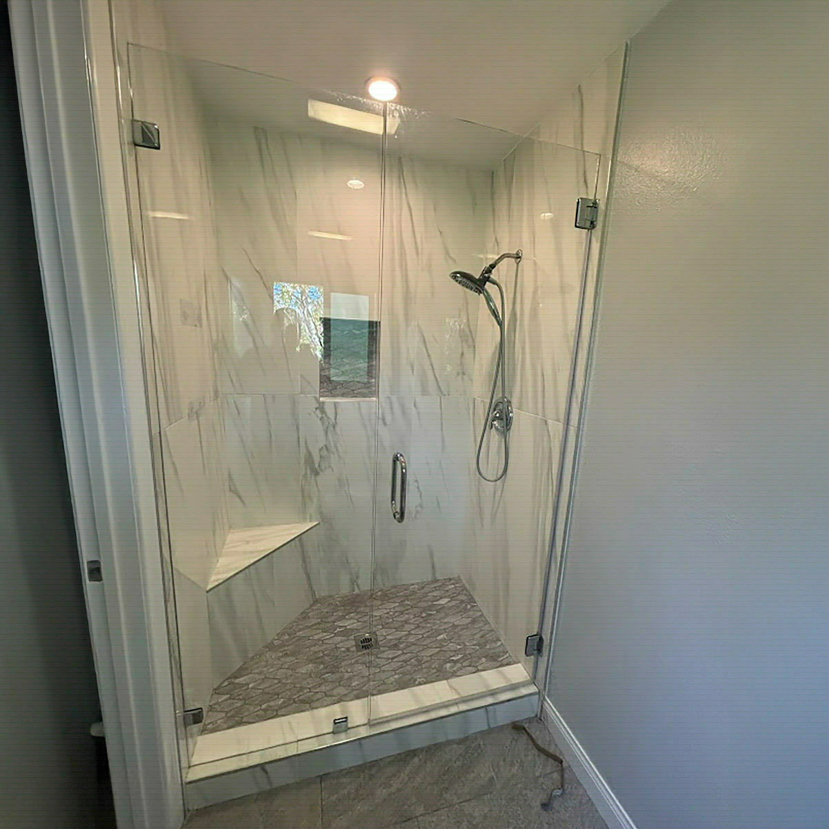 Tub-to-shower conversion with a low-threshold entry by CALbath Renovations